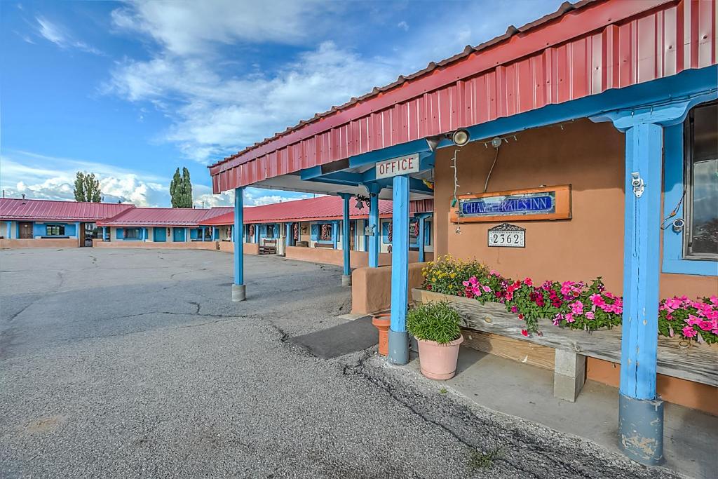 an empty parking lot in front of a motel at Chama Trails Motel in Chama