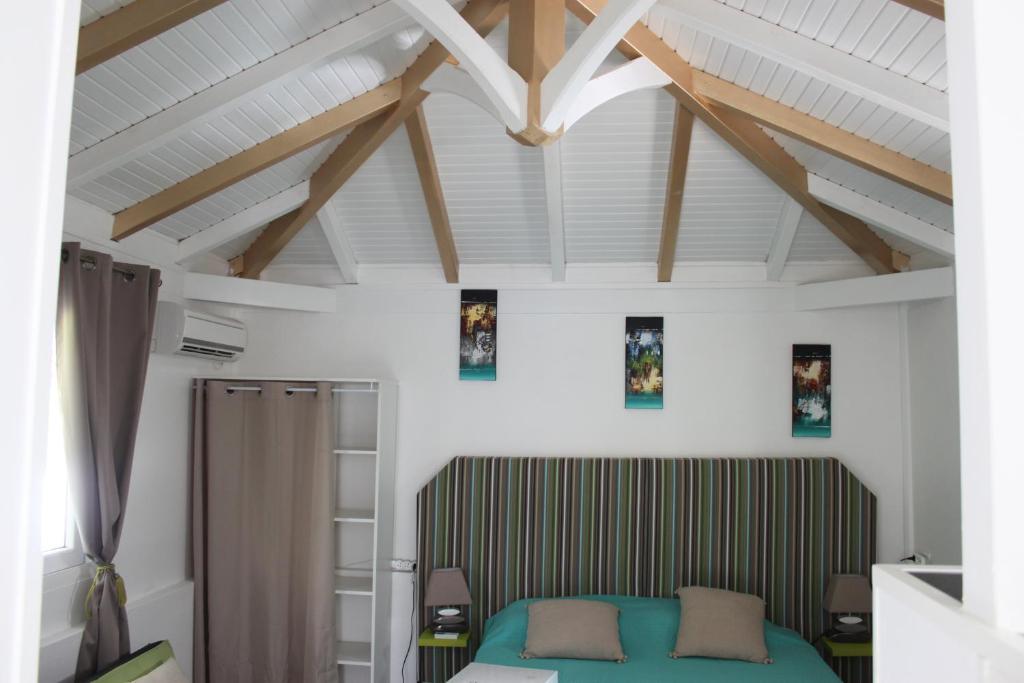 Postel nebo postele na pokoji v ubytování Résidence B&L Lagon : Bungalow Atoll