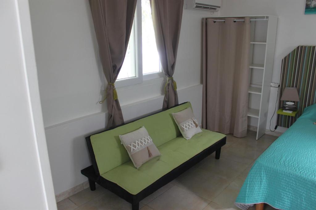 Postel nebo postele na pokoji v ubytování Résidence B&L Lagon : Bungalow Atoll