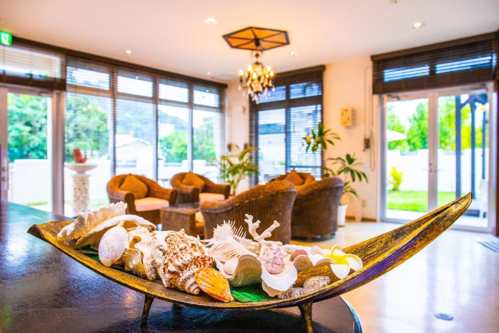 a tray of food on a table in a living room at Kerama Terrace in Tokashiki