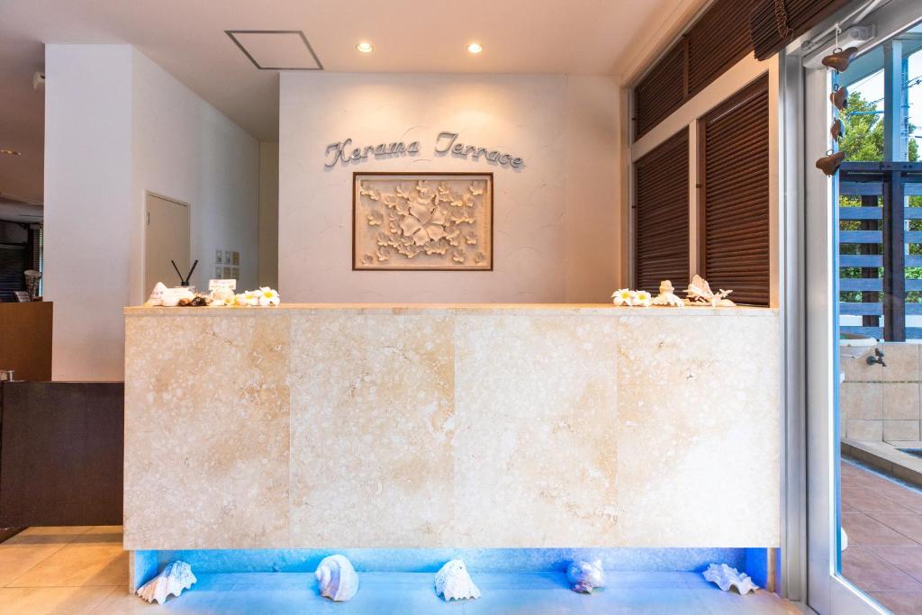 a counter in a store with a sign that reads divine defense at Kerama Terrace in Tokashiki