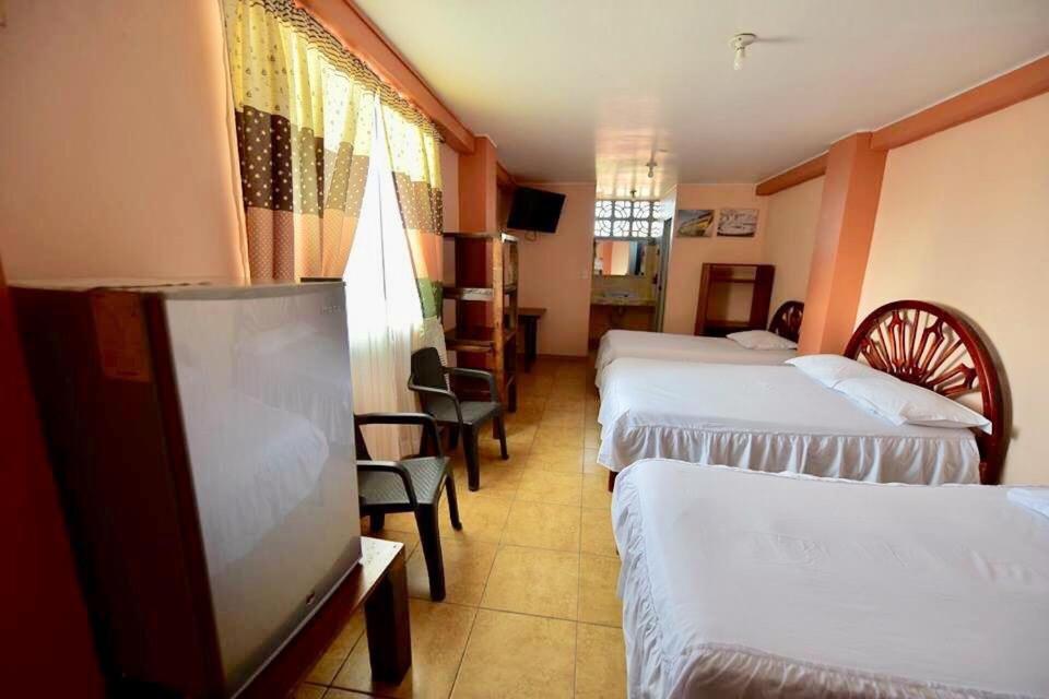 Postel nebo postele na pokoji v ubytování Hotel La Barca