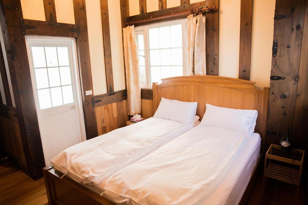 Postel nebo postele na pokoji v ubytování Black Forest Manor