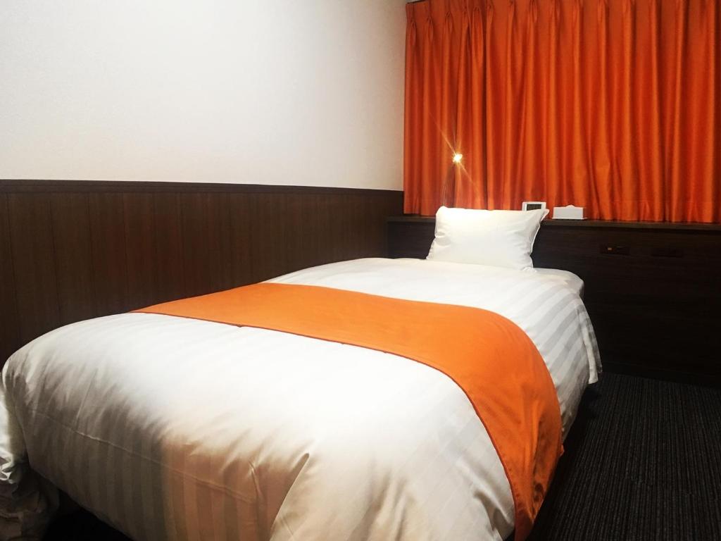 Postel nebo postele na pokoji v ubytování High Set HOTEL SHIZUOKA Inter