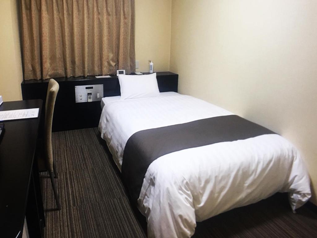 Postel nebo postele na pokoji v ubytování High Set HOTEL SHIZUOKA Inter