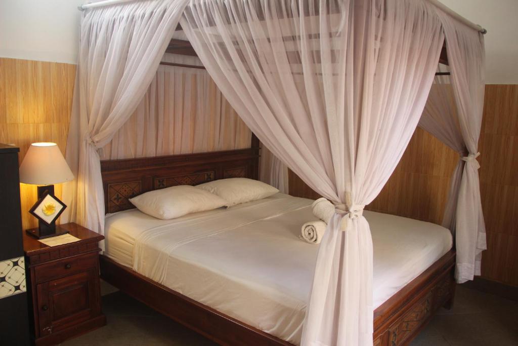 Lova arba lovos apgyvendinimo įstaigoje Nitya Home Stay Lembongan