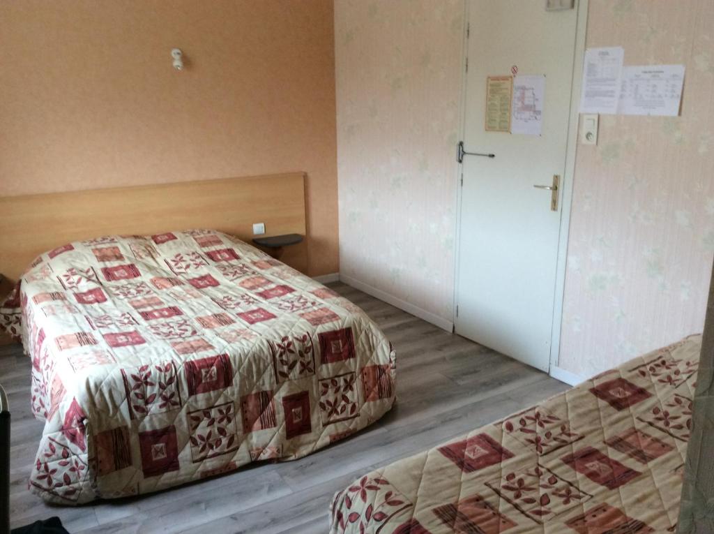 Postel nebo postele na pokoji v ubytování Le Trianon