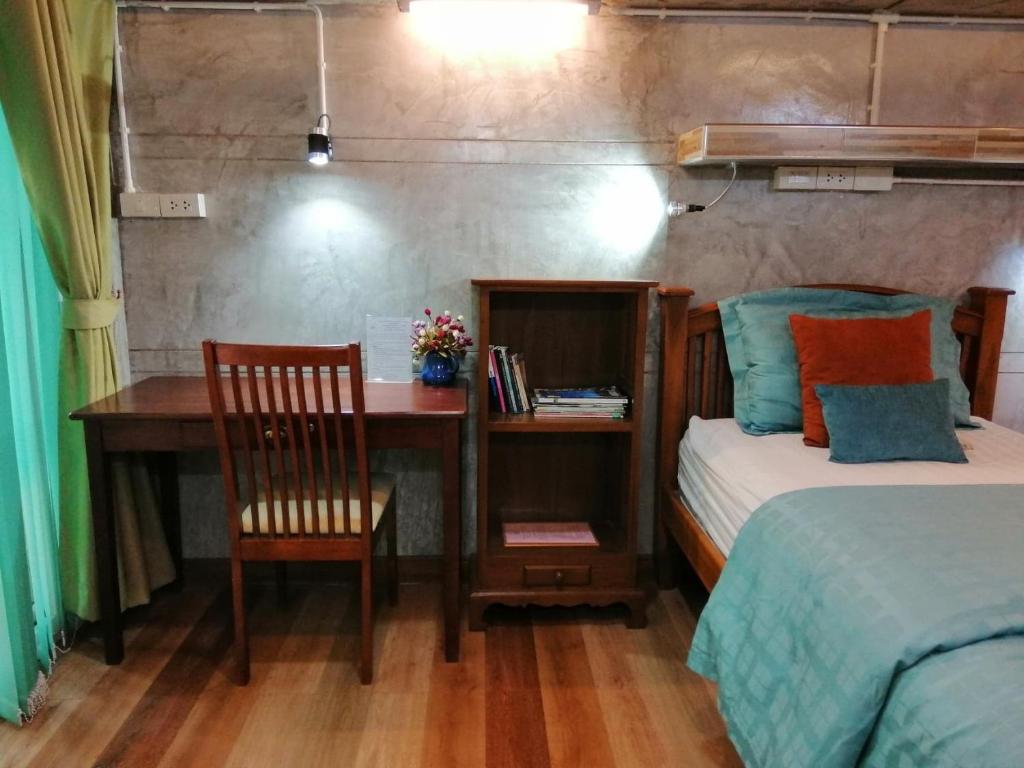 Postel nebo postele na pokoji v ubytování Loei Huen Hao Hug Home&Resort