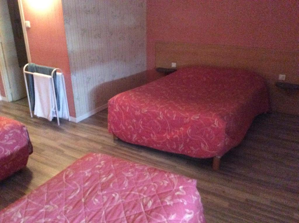 Postel nebo postele na pokoji v ubytování Le Trianon