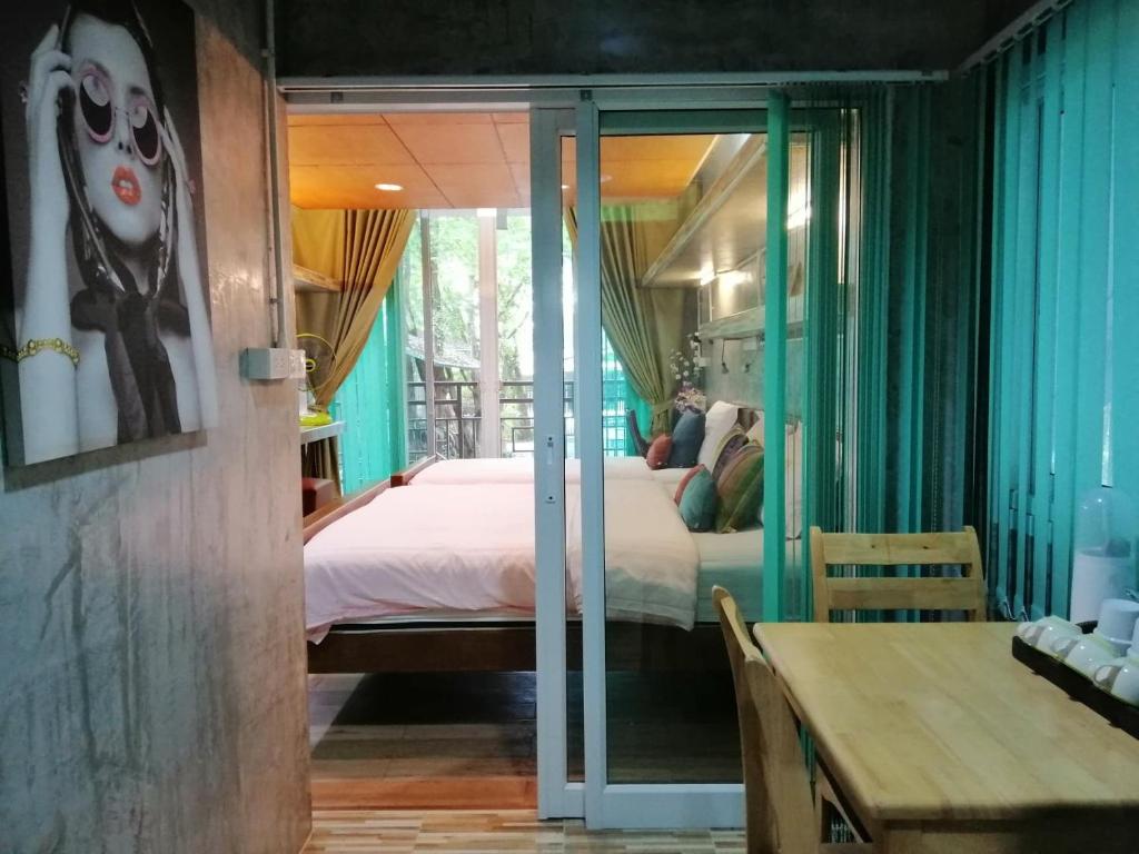 Postel nebo postele na pokoji v ubytování Loei Huen Hao Hug Home&Resort