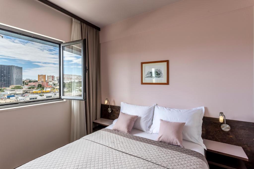 Posteľ alebo postele v izbe v ubytovaní Hotel As