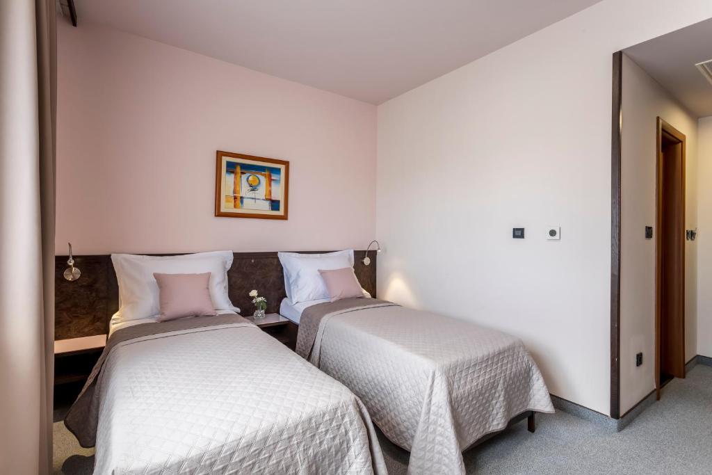 Posteľ alebo postele v izbe v ubytovaní Hotel As