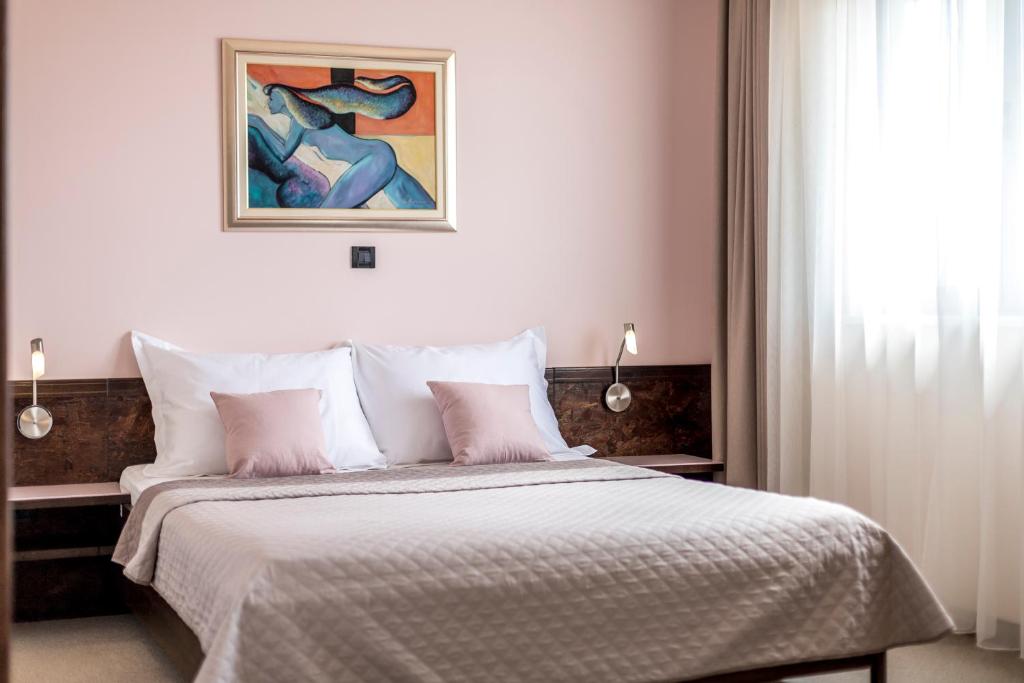 Posteľ alebo postele v izbe v ubytovaní Hotel As