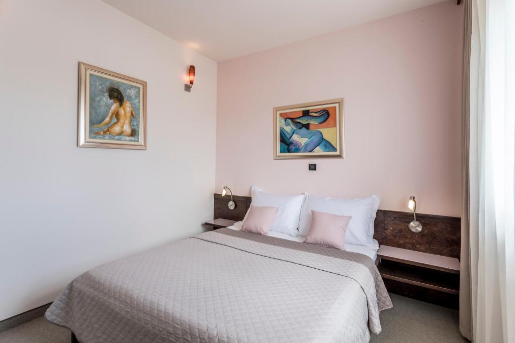 Posteľ alebo postele v izbe v ubytovaní Hotel As