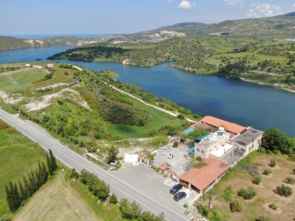 an aerial view of a house next to a lake at Studio with view in Polis area in Paphos City
