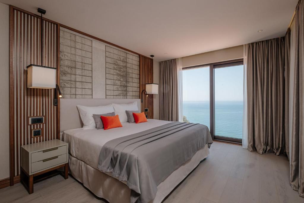 Postel nebo postele na pokoji v ubytování ĀNANTI Resort, Residences & Beach Club - The Leading Hotels of the World