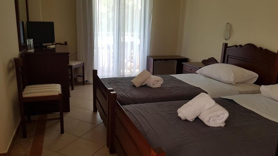 Postel nebo postele na pokoji v ubytování Skiros Palace Hotel