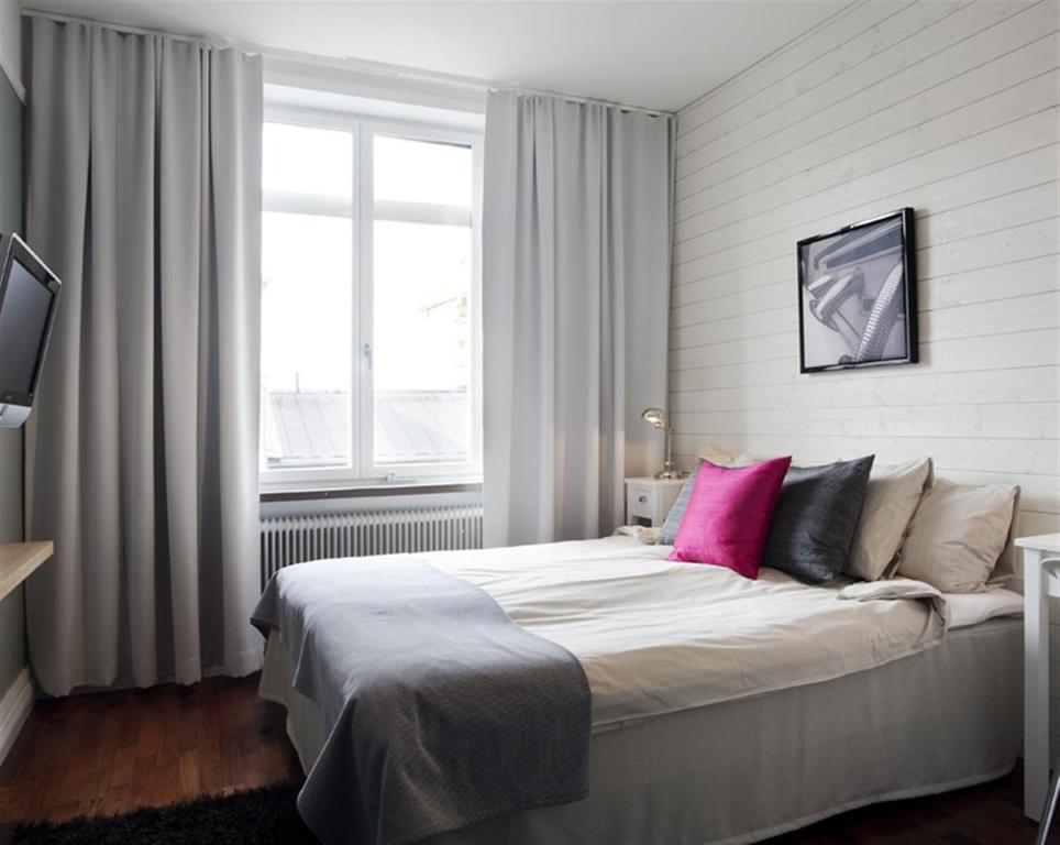 Postel nebo postele na pokoji v ubytování Hotel Örebro