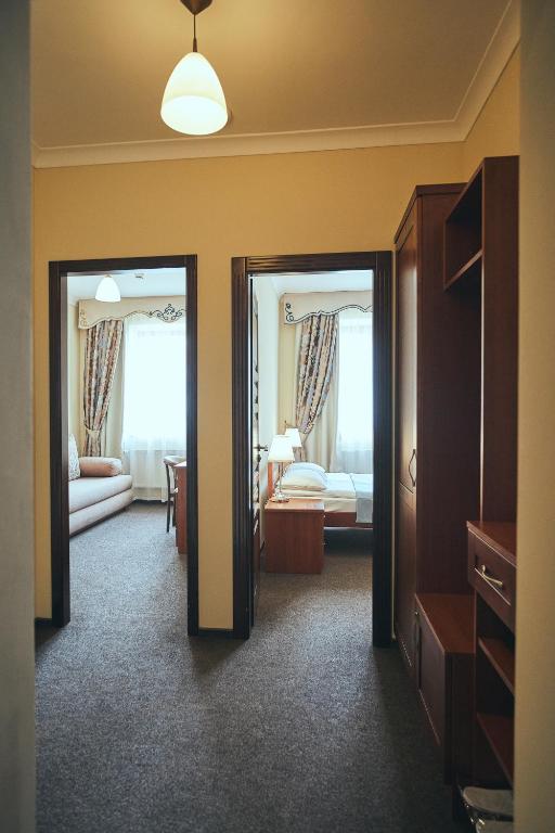 Postel nebo postele na pokoji v ubytování Hotel Patriarshyi
