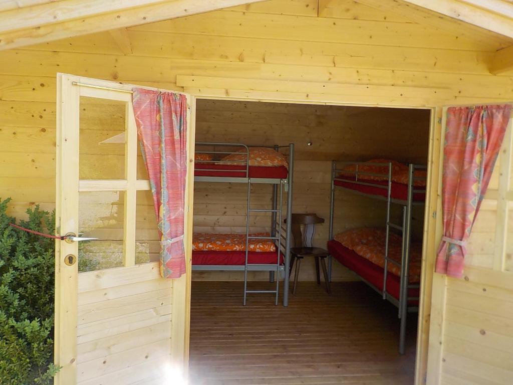Postel nebo postele na pokoji v ubytování Zehrermühle Campinghütte