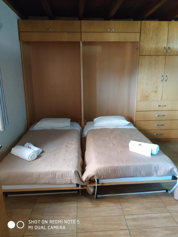 Postel nebo postele na pokoji v ubytování Savvas Studios