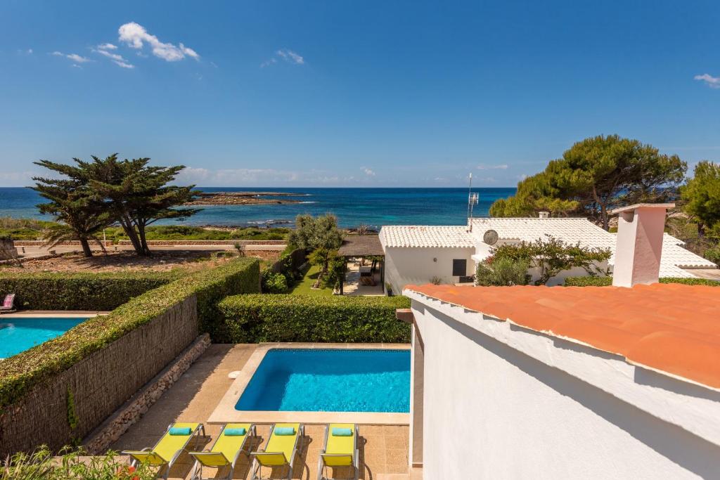 a villa with a swimming pool and a view of the ocean at Villa BiniLlor by Mauter Villas in Binissafuller