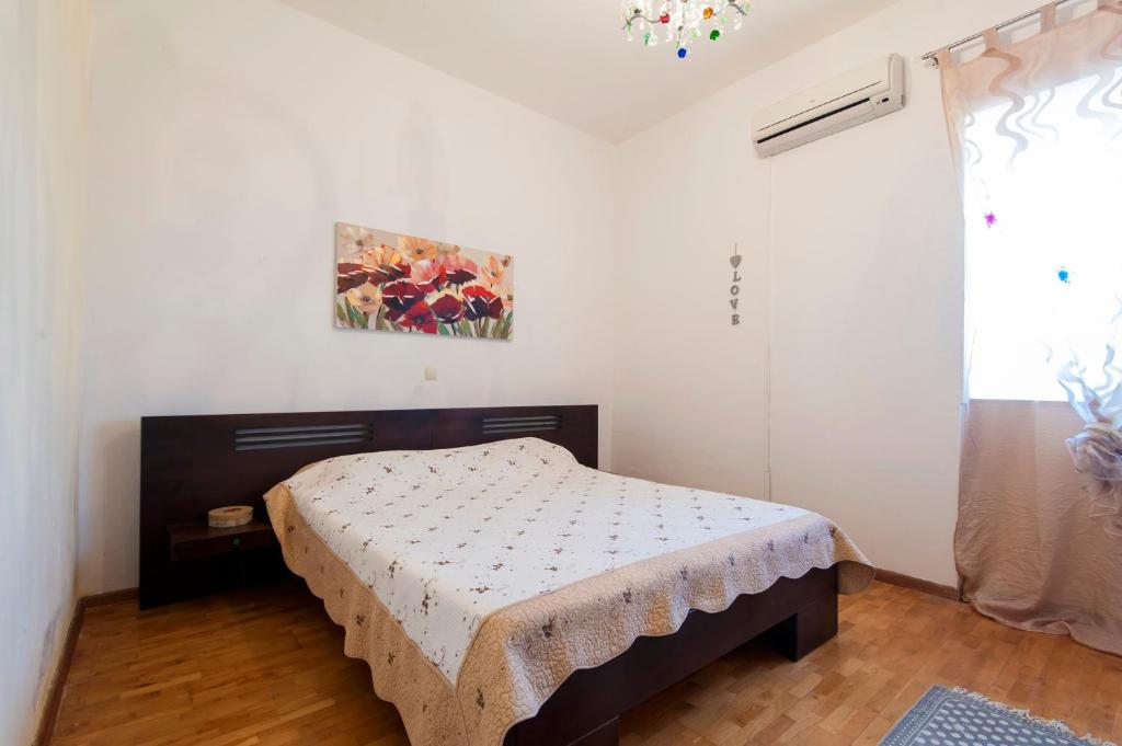 Łóżko lub łóżka w pokoju w obiekcie Resort Villa Moses