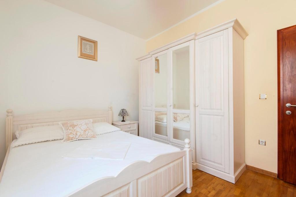 Łóżko lub łóżka w pokoju w obiekcie Resort Villa Moses