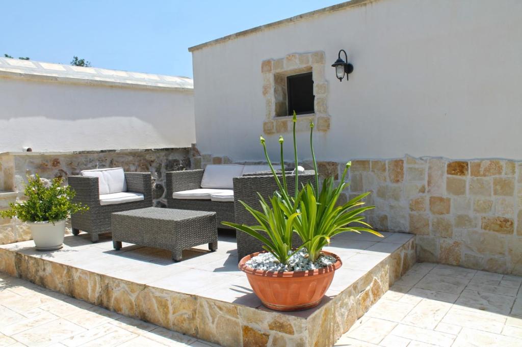 Posezení v ubytování Trullo degli Augelli