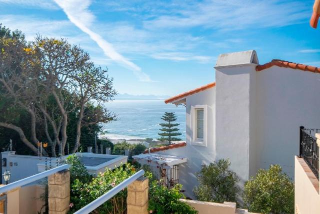 a white house with a view of the ocean at Lavender hill in Plettenberg Bay