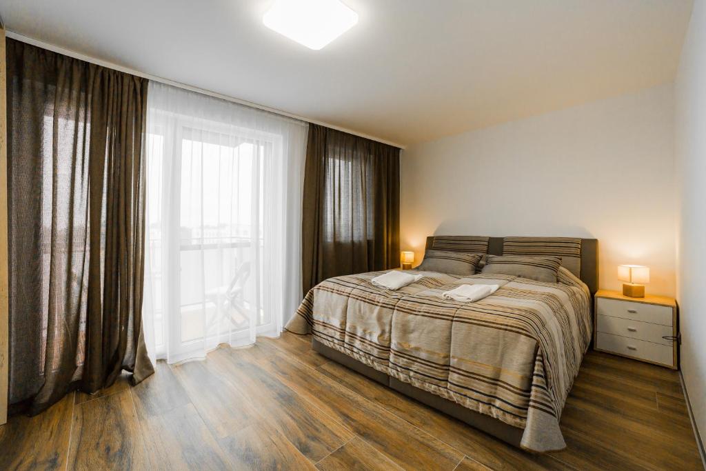 Postel nebo postele na pokoji v ubytování Apartmány pri vstupe do Aquaparku