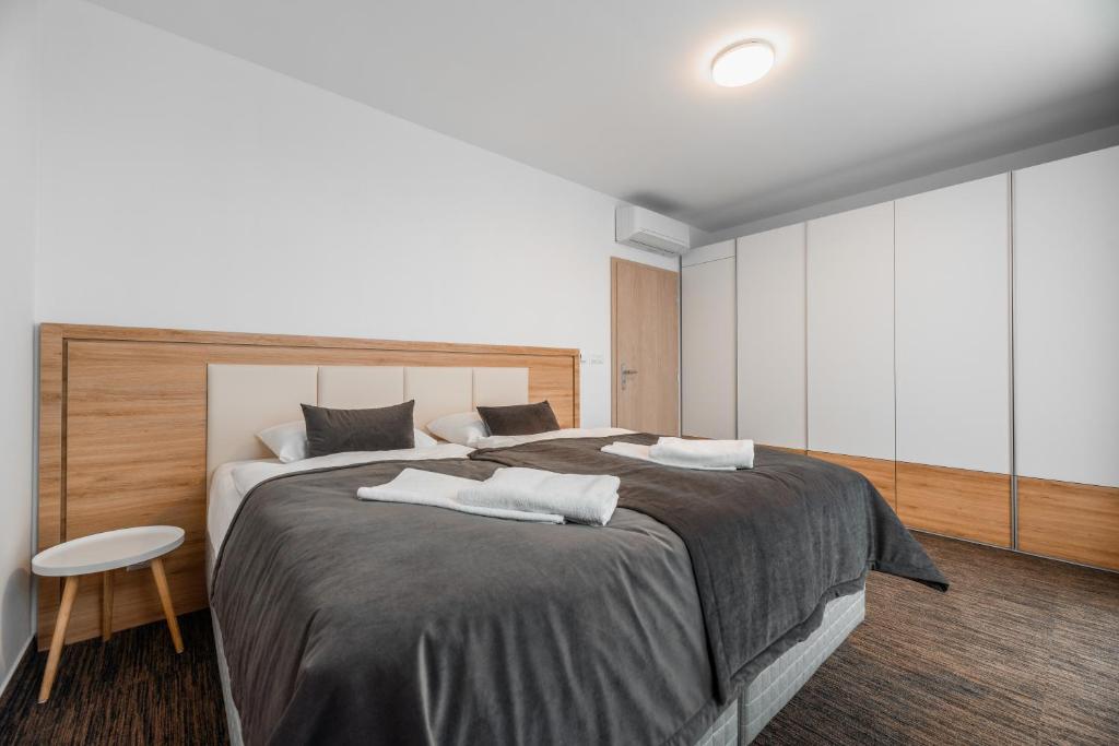 Postel nebo postele na pokoji v ubytování Apartmány pri vstupe do Aquaparku