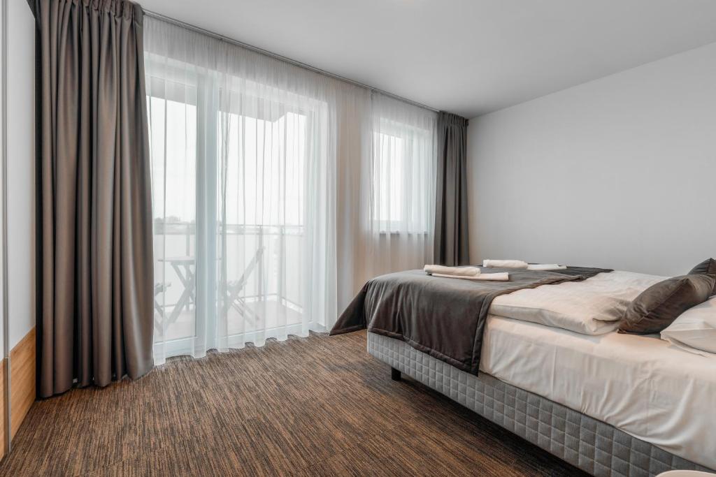 Postel nebo postele na pokoji v ubytování Apartmány pri vstupe do Aquaparku