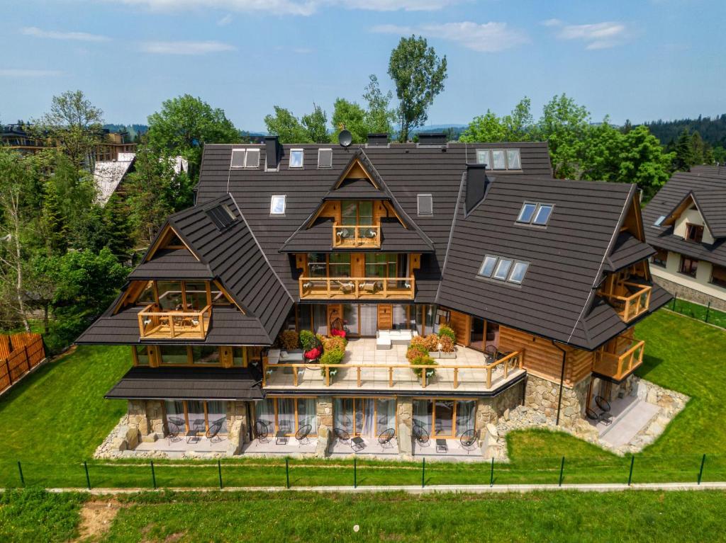 an aerial view of a house with a gambrel roof at Nosal Apartment in Zakopane