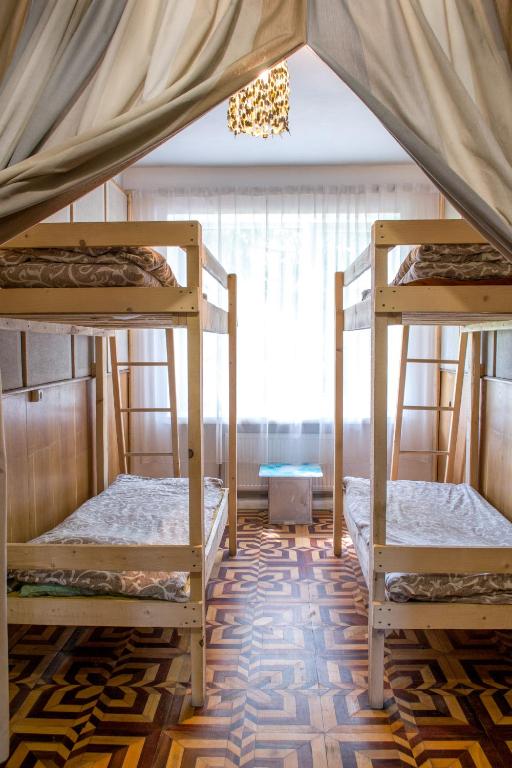Postel nebo postele na pokoji v ubytování Baron Munchausen Guest House
