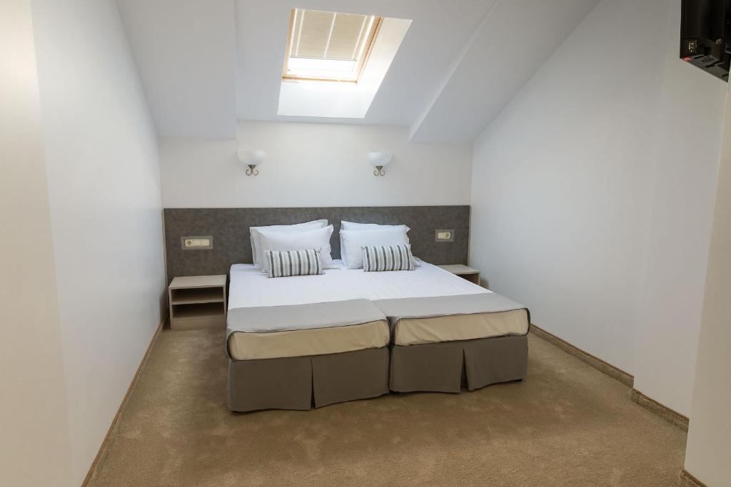 Postel nebo postele na pokoji v ubytování Hotel Central