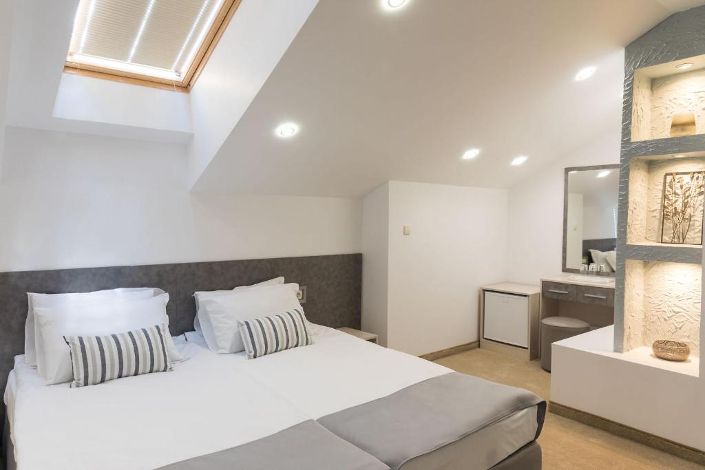 Postel nebo postele na pokoji v ubytování Hotel Central