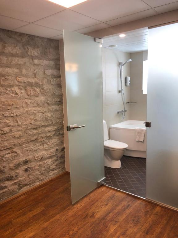 a bathroom with a toilet and a sink at City Hotel Tallinn by Unique Hotels in Tallinn