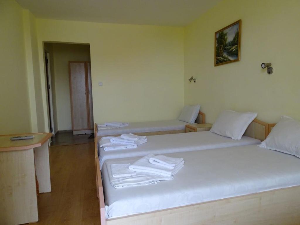 Postel nebo postele na pokoji v ubytování Kovachevi House