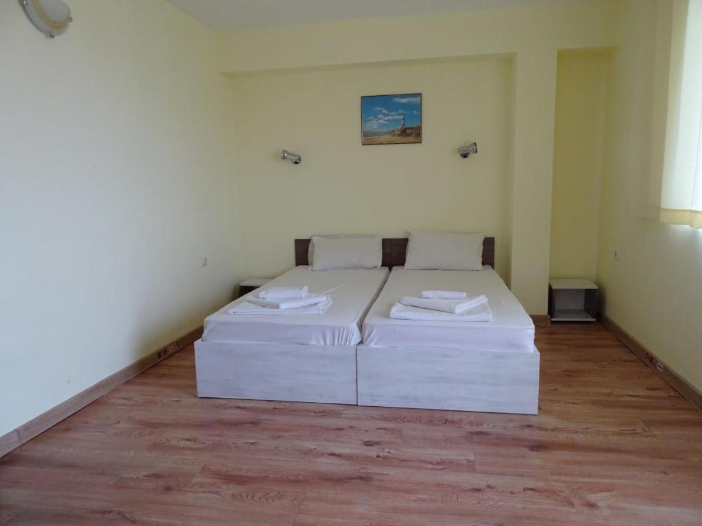 Postel nebo postele na pokoji v ubytování Kovachevi House