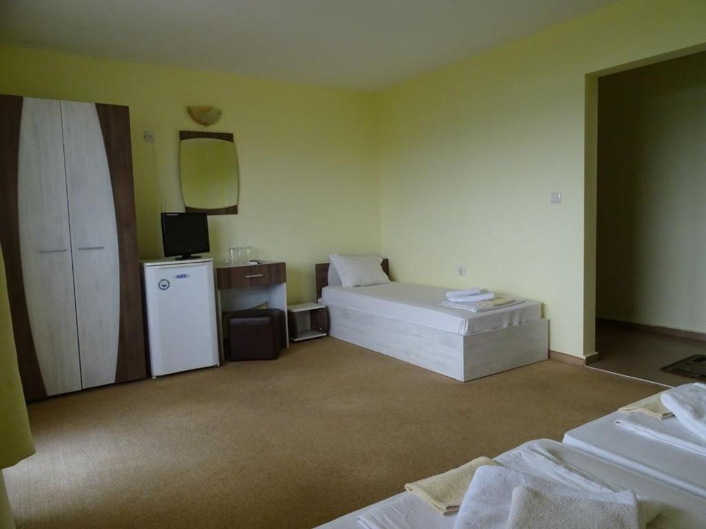 Postel nebo postele na pokoji v ubytování Kovachevi House