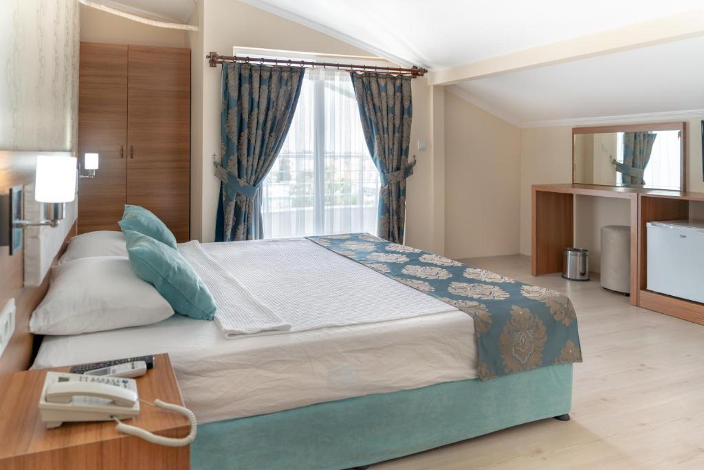 Postel nebo postele na pokoji v ubytování OLYMPIC HOTELS Belek