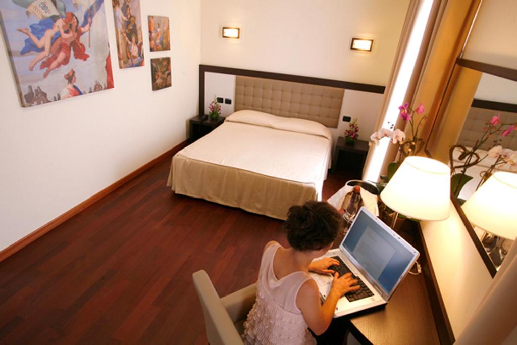 Postel nebo postele na pokoji v ubytování Hotel Le Macine