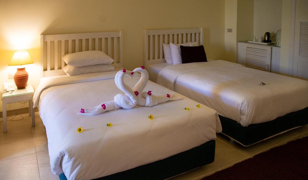 Postel nebo postele na pokoji v ubytování Caesar Bay Resort
