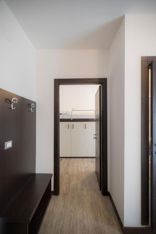 an empty room with a door leading into a building at Hotel Bristol in Caorle
