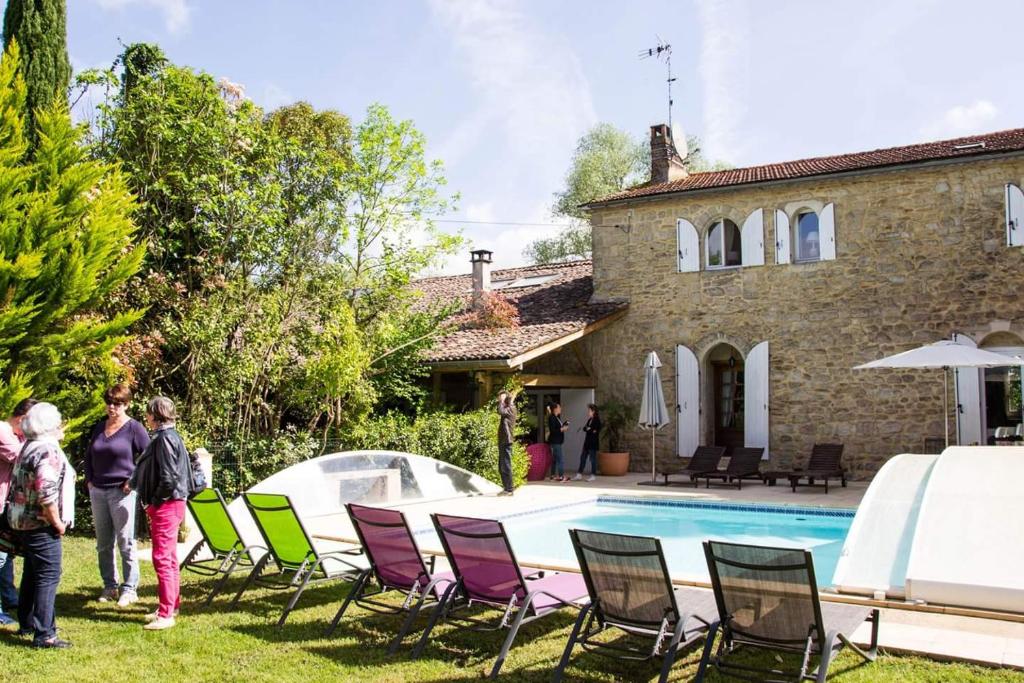 a group of people standing in front of a house at Le Clos d'Any in Fontet