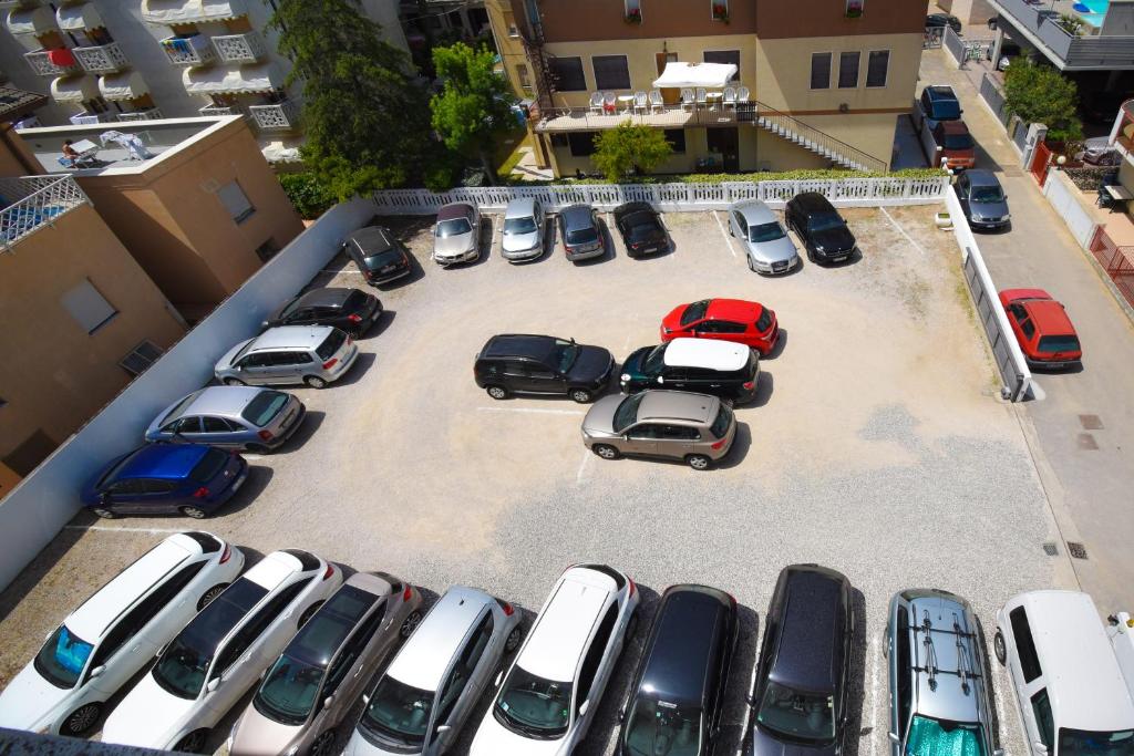 an aerial view of cars parked in a parking lot at Hotel Continental in Caorle