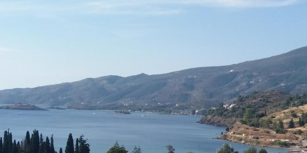 a view of a lake with mountains in the background at Studio in Poros in Poros