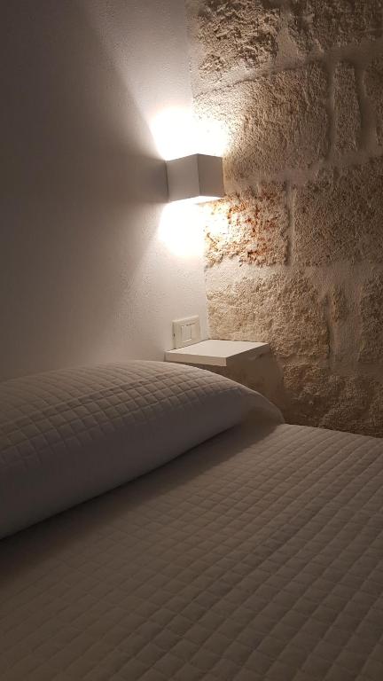 Postel nebo postele na pokoji v ubytování La casa di Sara