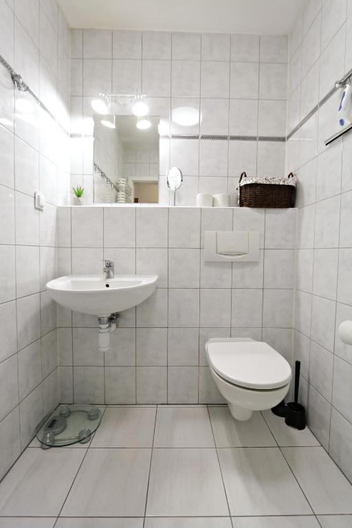 Kúpeľňa v ubytovaní Ksiazat Pomorskich by Baltic Home